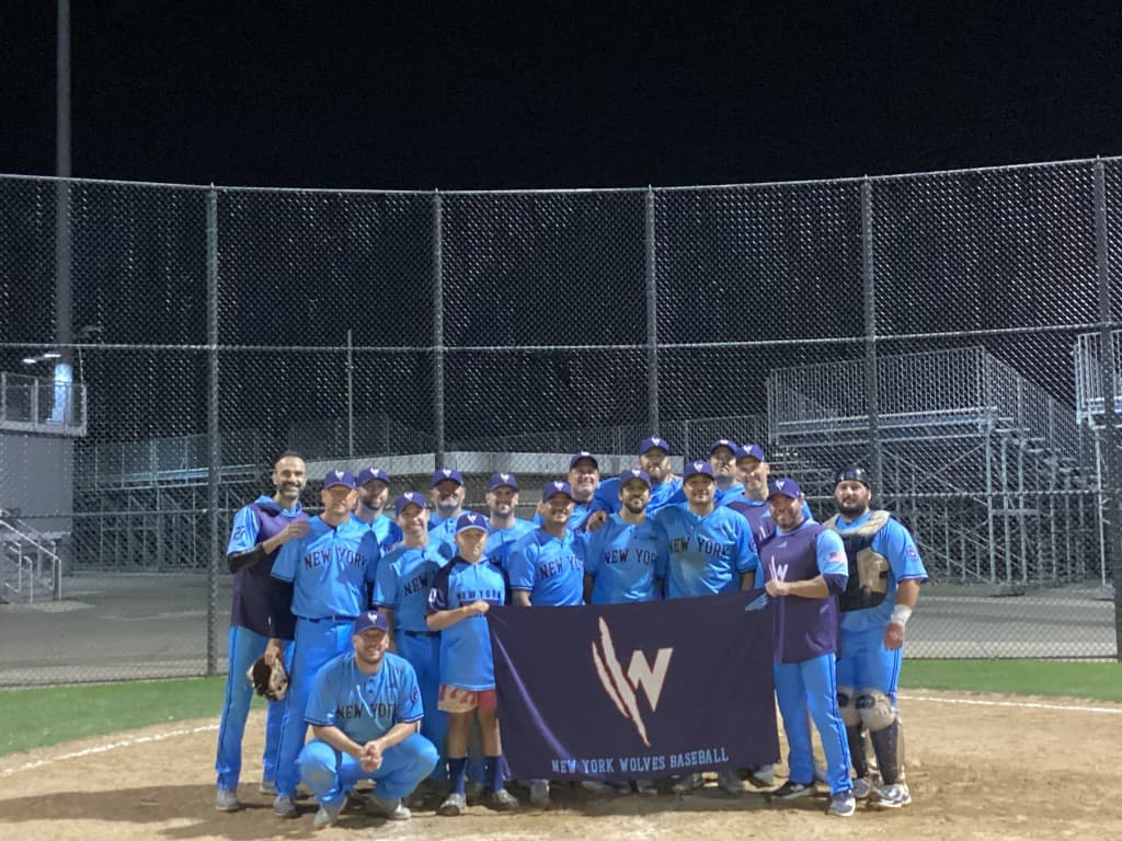 NY Wolves championship team in full kit under the lights